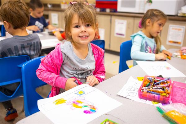 Students inside their classrooms learning. 